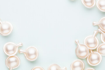 Hyaluronic acid capsule on pastel background.