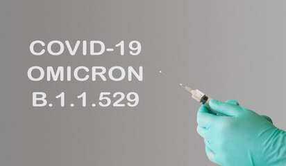 A doctor holds a vaccine against a new variant of omicron covid-19. Vaccine against the South...