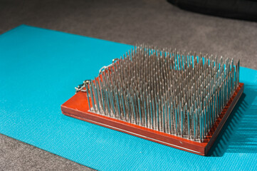 Sadhu board for yoga. Board with nails for spiritual practices.