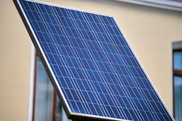 Obraz premium Solar photovoltaic panels mounted on city street pole for electricity supply of streetlights and surveillance cameras