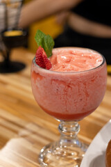 frozen red strawberry daiquiri, in a glass cup