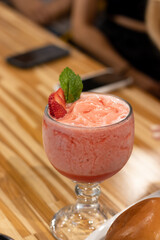 frozen red strawberry daiquiri, in a glass cup