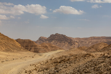 Mountains, rocks and hills of Judean desert in Israel, Middle East landmarks of Old Testament Bible times. Aerial view of Dead sea spa and recreation areas. High quality photo