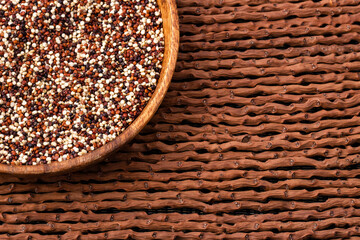 Mix of red, white and brown quinoa in the bowl