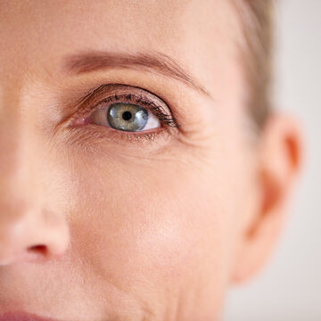 Enhance and preserve the skin youre in. Closeup shot of an attractive mature woman with the focus on her eyes.