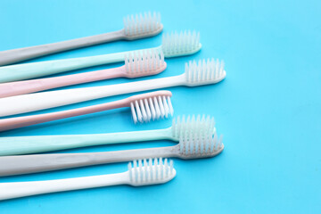 Fototapeta na wymiar Toothbrushes on blue background. Top view