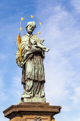 Fototapeta premium Statue of John of Nepomuk on Charles Bridge in Prague