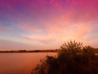 Fototapeta na wymiar Red sunset, dawn over the lake, river