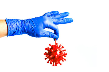 Doctor's hand in a rubber glove holds coronavirus.COVID-19