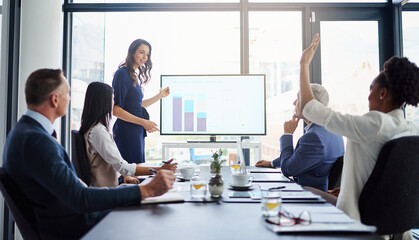 Shes eager to add her input. Cropped shot of a businesswoman giving a presentation in a boardroom.