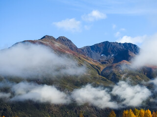 Landscape in Alaska with foggy mountains in fall
