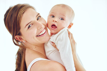 I want the best for my baby. Portrait of a loving mother carrying her baby boy at home.