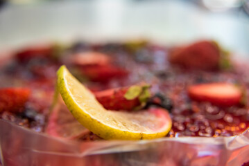 red fruit cheescake with a slice of lime
