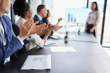 Celebrating another successful presentation. Cropped shot of businesspeople applauding a colleagues...