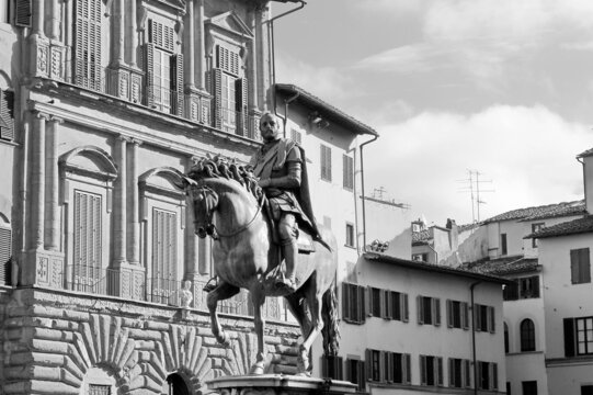 Florence. Italy. March 11, 2019. Monument of Cosimo Medici I is a bronze equestrian statue by Giambologna erected in 1594 in the Piazza della Signoria. Black and white photo.