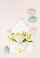 Festive Easter flat lay with fresh flowers and eggs