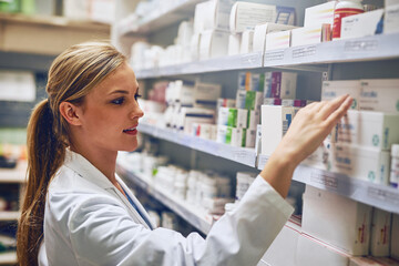 Choosing the right treatment for you. Shot of a pharmacist at work.
