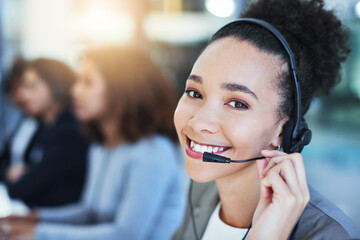 Its my duty to assist. Portrait of a young woman working in a call centre.