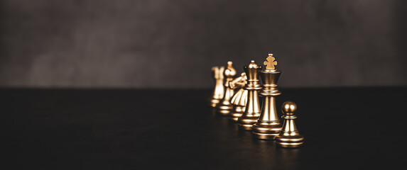 Close-up king chess standing in line teamwork on chess board concepts challenge or battle fighting of business team and leadership strategy and organization risk management or team player.