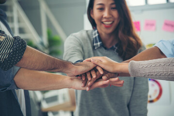 Group of diversity people fist bump holding hands together power of tag team. Teamwork Multiethnic...