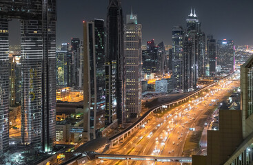 Fototapeta na wymiar Cityscape and skyline at night in Dubai