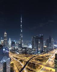Fototapeta na wymiar Modern city skyline and cityscape at night in Dubai UAE