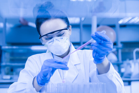 Scientist working in laboratory - Powered by Adobe