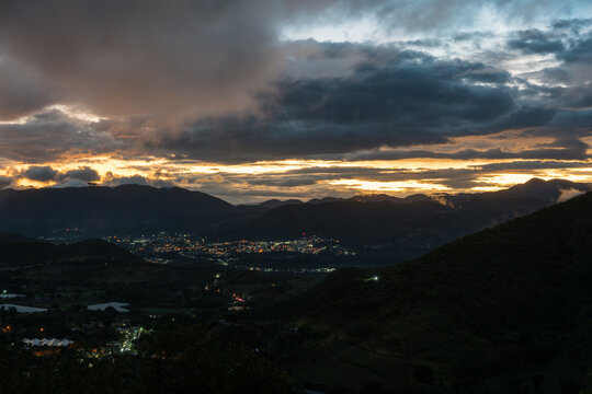 Dramatic sunset image of the small Caribbean mountain town of Ocoa, in the Dominican Republic.