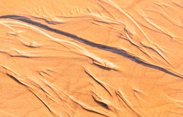Orange color sand texture and background.