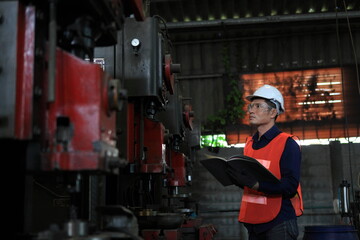  engineer on site working for production or maintenance  big machine industry in factory