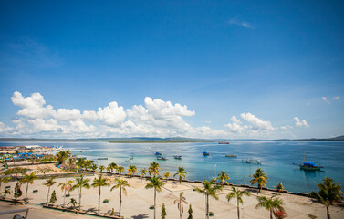 City park on the outskirts of Kamali Beach with traditional fishing boats in Baubau City, Indonesia. Kamali Beach is one of the tourist attractions in Baubau city.