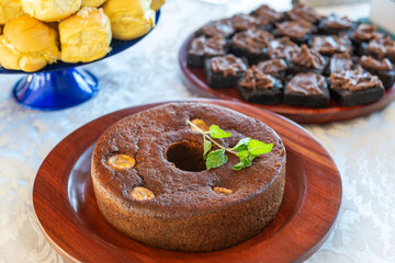 Banana cake on a wooden tray on a table.