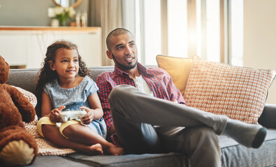 The only thing that cant be paused is bonding time. Shot of an adorable little girl and her father...