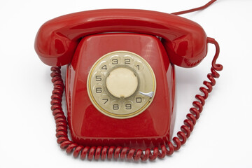 Old red telephone, isolated on a white background 