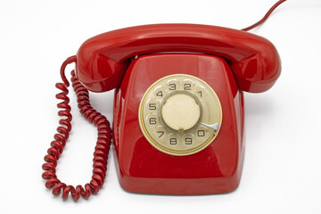 Old red telephone, isolated on a white background 