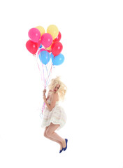 
Full length portrait of blonde girl wearing party dress, holding bunch of colourful balloons. Isolated on white studio background