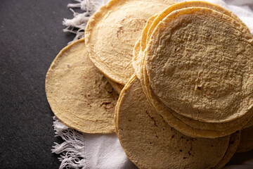 Corn Tortillas. Food made with nixtamalized corn, a staple food in several American countries, an...