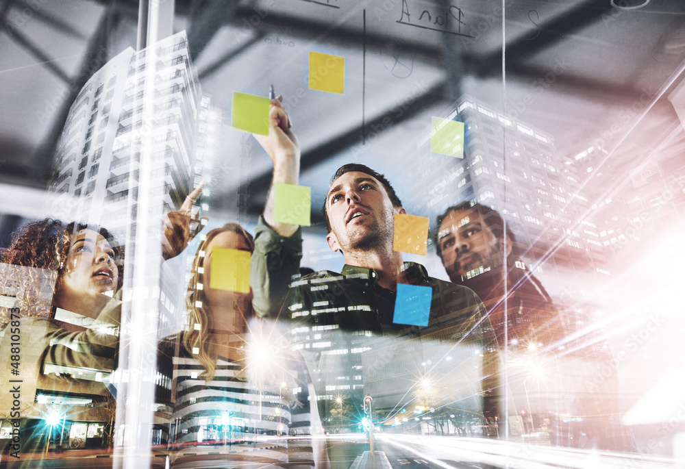 Leinwandbilder Taking a collaborative approach to problem solving. Digitally enhanced shot of a group of colleagues working on a glass wall.