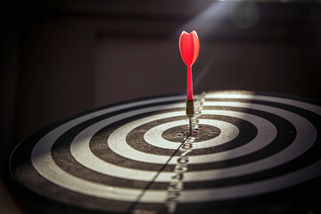 Bullseye target goal or dartboard has dart arrow throw hitting center shooting for financial business targeting planning to winner concept.