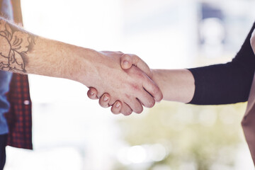 Fototapeta na wymiar We do it together, thats the deal. Closeup shot of businesspeople shaking hands in an office.