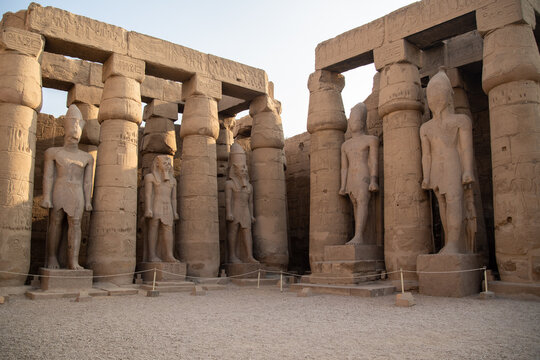 Columns and statues in the courtyard of Ramses II of the Luxor Temple. Luxor (destroyed Thebes). Egypt.