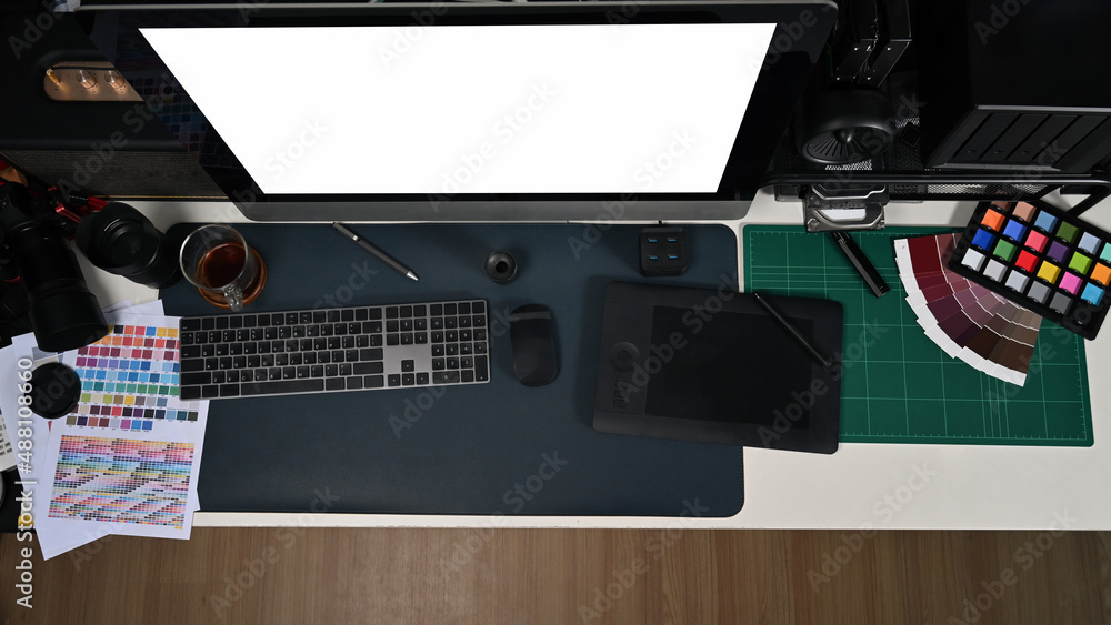 Aufkleber creative designer workplace from above with computer graphic tablet and color swatch samples.