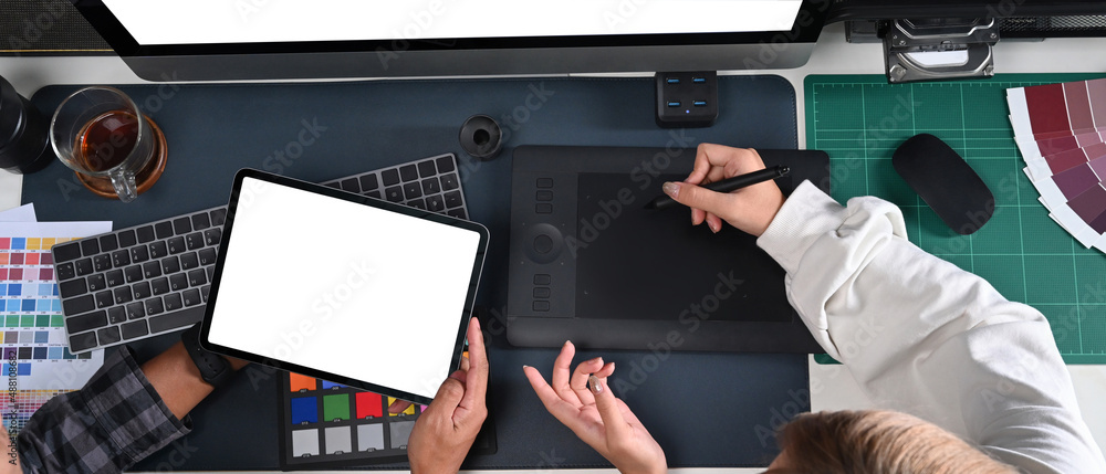 Poster team of graphic designer working with digital tablet and discussing on new project together.