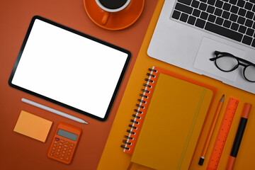 Flat lay mockup digital tablet, laptop computer and supplies on colorful background.