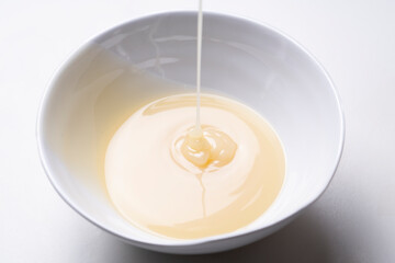 condensed milk isolated on a white table background