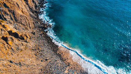 Drone shot of waves at the beach