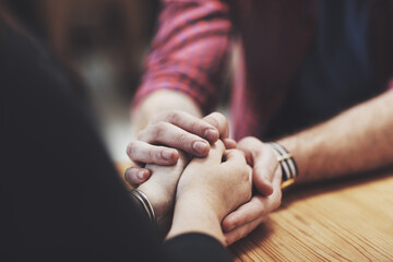 Heartfelt hands. Cropped shot of two people holding hands in comfort.