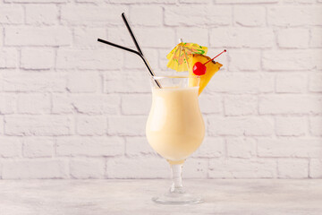 Traditional caribbean cocktail pina colada in a glass.