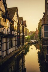 The Old Weavers witch ducking stool overhanging the river Stour which runs through Canterbury,...