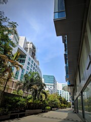 Modern office buildings in the financial district, Architecture details Modern Building Glass facade Business background, Windows of Skyscraper Business Office with blue sky, Corporate building,india